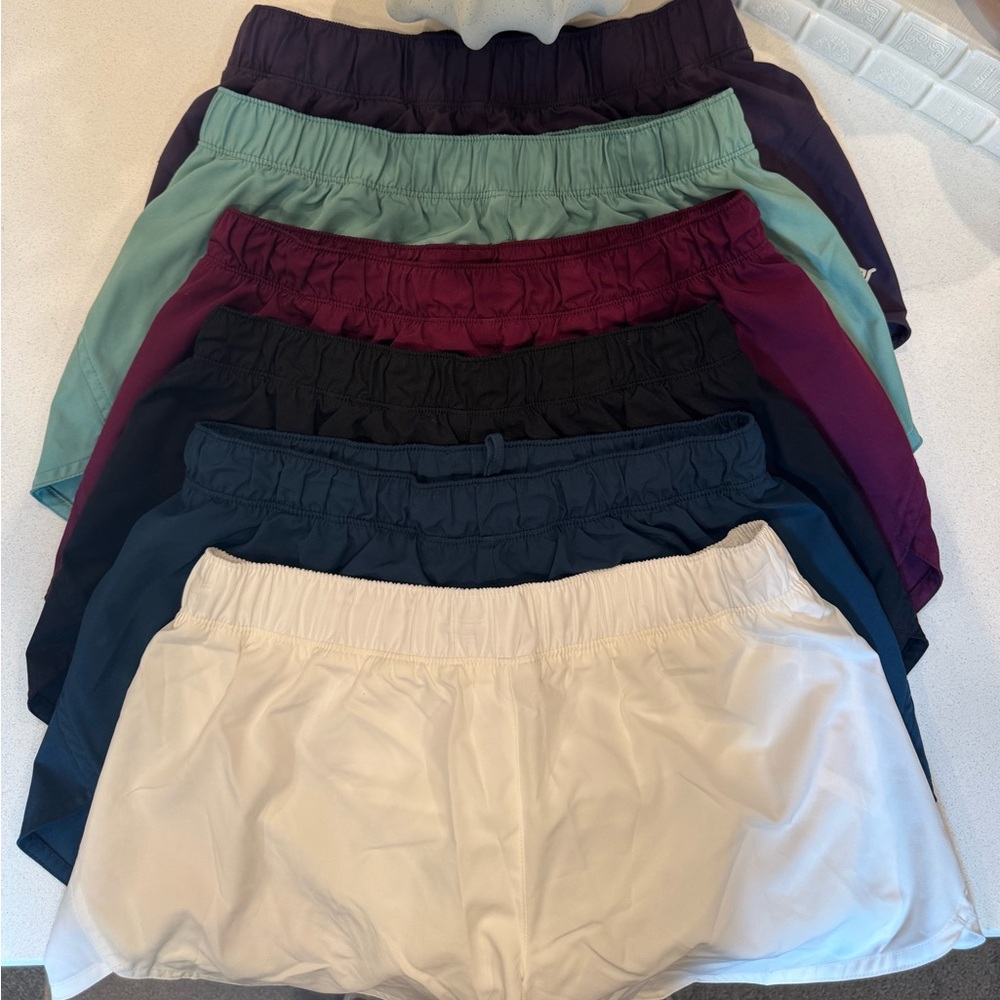 6 Pair of Old Navy Running Shorts in solid colors